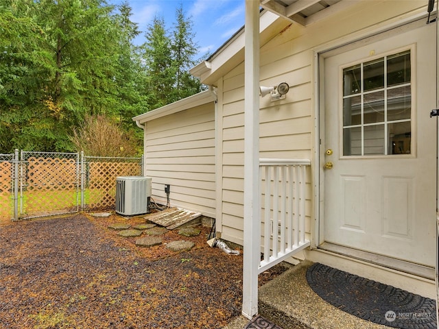 view of exterior entry with central AC