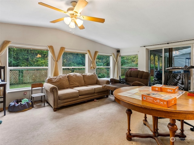 living room featuring vaulted ceiling, carpet floors, and ceiling fan