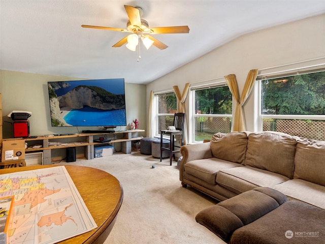living room with lofted ceiling, carpet flooring, and ceiling fan