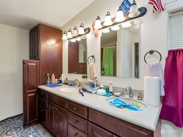 bathroom featuring vanity and vaulted ceiling