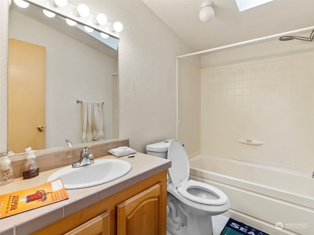 full bathroom featuring shower / tub combination, toilet, a skylight, vanity, and tile patterned floors