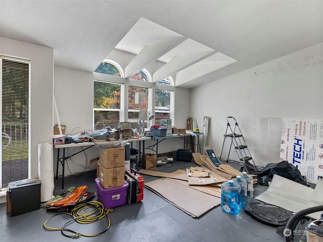 miscellaneous room featuring concrete flooring and a textured ceiling