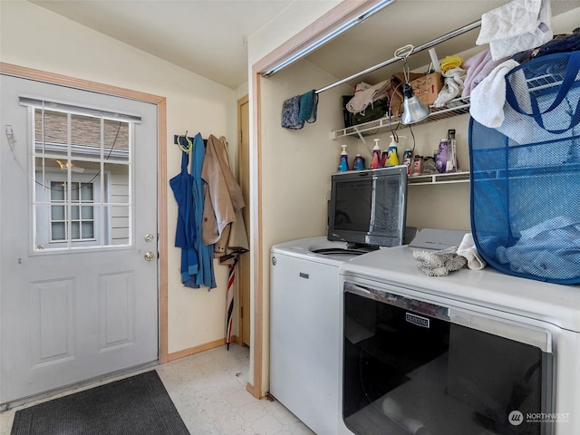 clothes washing area featuring washer and dryer