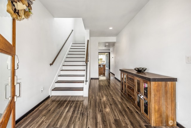 stairway featuring hardwood / wood-style floors