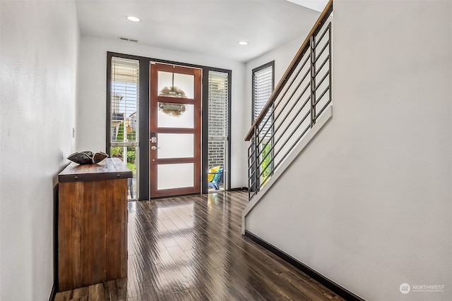 foyer with dark hardwood / wood-style flooring