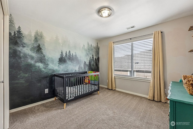 carpeted bedroom with a crib