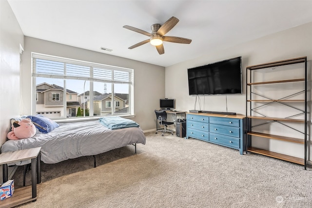 bedroom featuring light colored carpet and ceiling fan