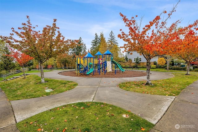 view of jungle gym with a lawn