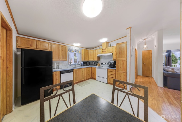 kitchen with light hardwood / wood-style flooring, backsplash, sink, crown molding, and white appliances