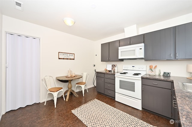 kitchen with sink and white appliances