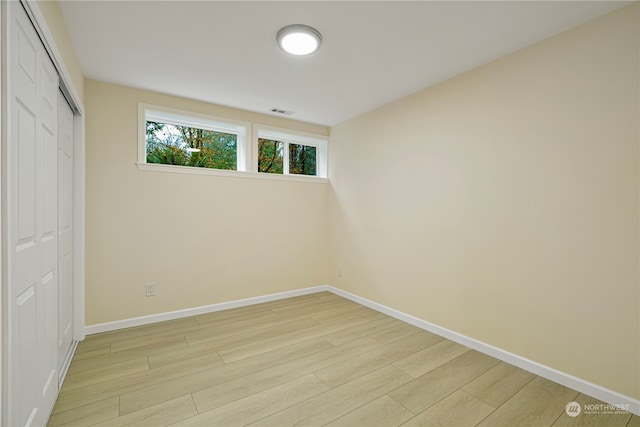 23405 NE 73rd St, Redmond, WA 98053 - unfurnished bedroom featuring a closet and light wood-type flooring