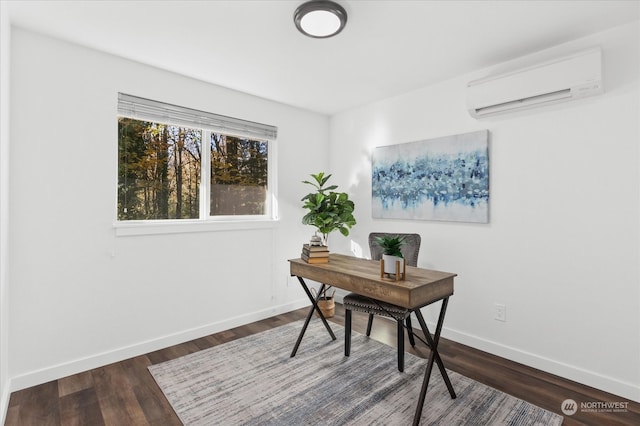 home office featuring an AC wall unit and dark hardwood / wood-style flooring