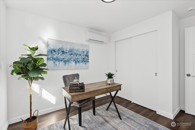 home office featuring a wall unit AC and dark hardwood / wood-style flooring