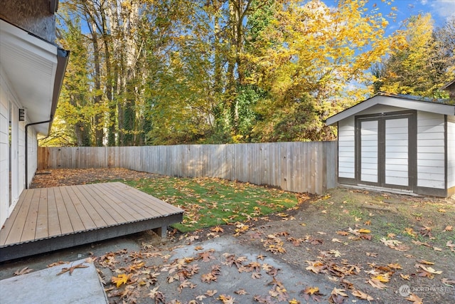 wooden terrace with a shed