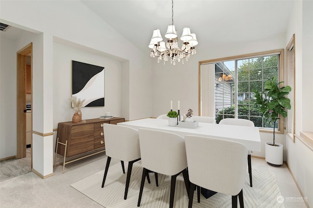 carpeted dining room with vaulted ceiling and a notable chandelier