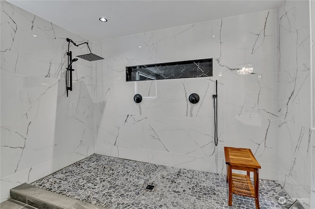 bathroom with a tile shower