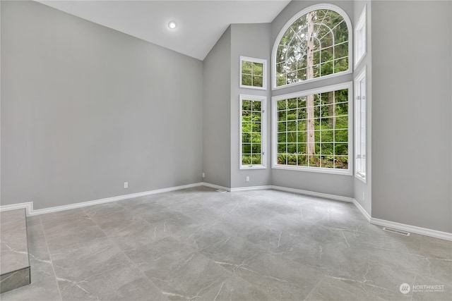 empty room with high vaulted ceiling