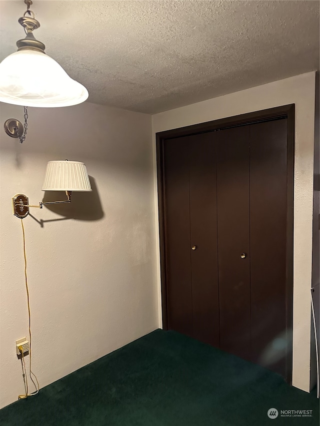 unfurnished bedroom with a closet and a textured ceiling