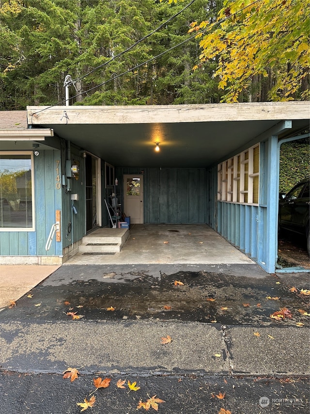 view of vehicle parking with a carport