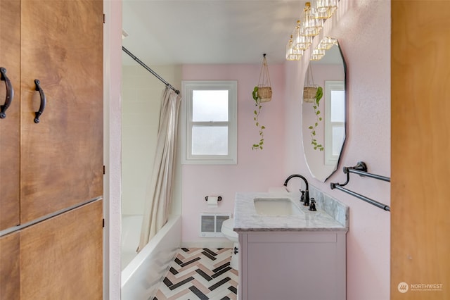 full bathroom featuring vanity, shower / tub combo with curtain, and toilet