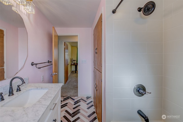 bathroom featuring vanity and a tile shower