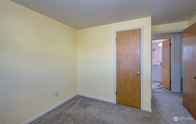 unfurnished bedroom featuring carpet