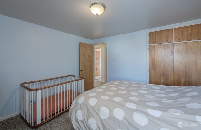 carpeted bedroom with a closet