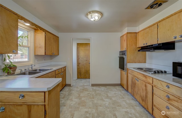 kitchen featuring oven, sink, and white gas cooktop