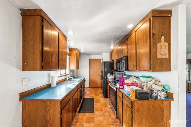 kitchen featuring black appliances and sink