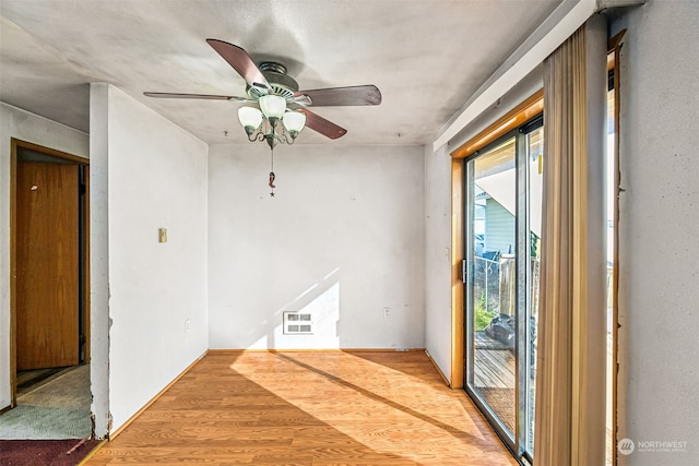 unfurnished room featuring wood-type flooring and ceiling fan