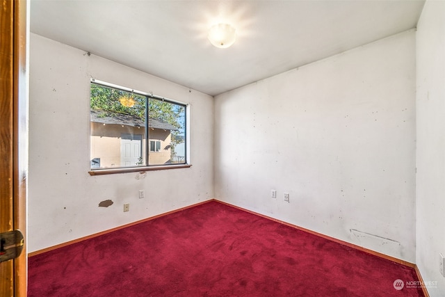 unfurnished room featuring carpet flooring