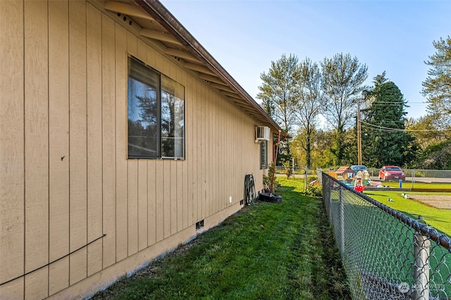 view of side of home featuring a lawn