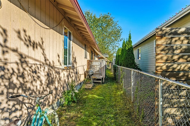 view of property exterior with a yard