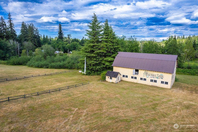 birds eye view of property featuring a rural view