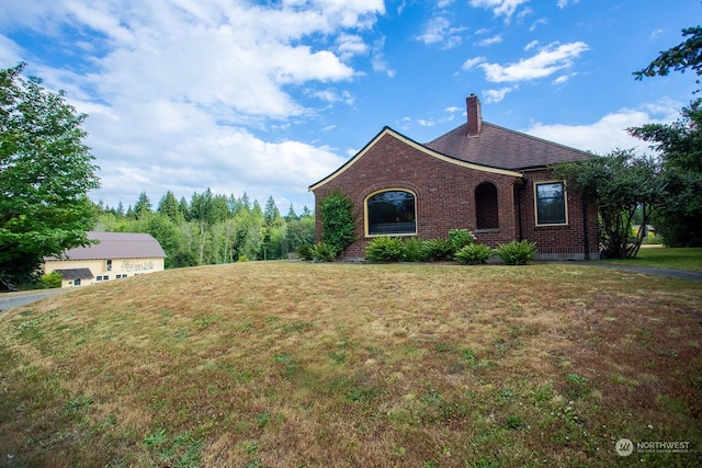 9346 Nels Nelson Rd NW, Bremerton, WA 98311 - view of front of property featuring brick siding, a chimney, and a front yard