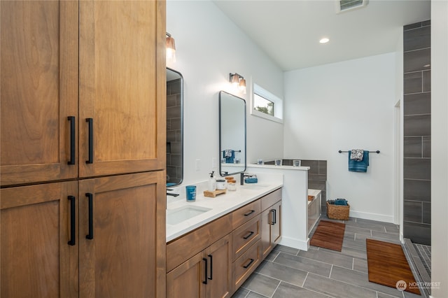 bathroom with vanity and a bathing tub