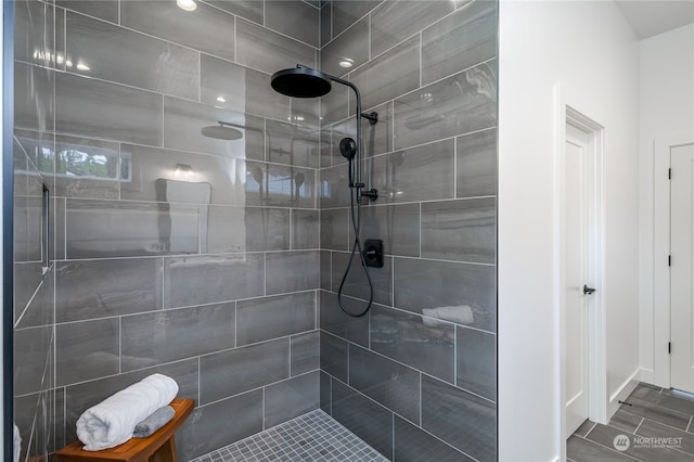 bathroom featuring a tile shower