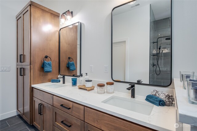 bathroom featuring vanity and an enclosed shower