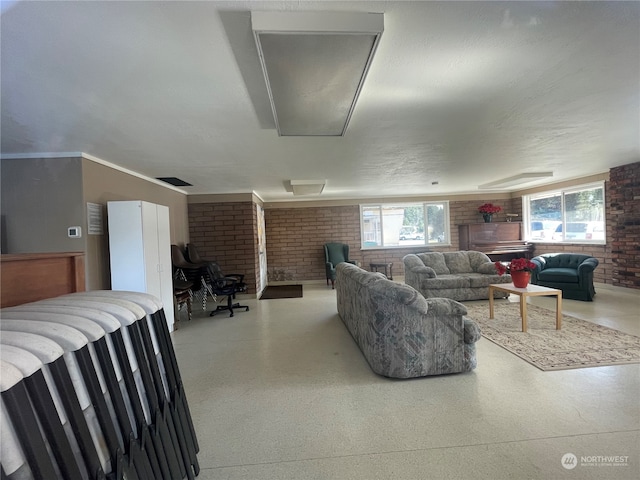 living room with a wealth of natural light and brick wall