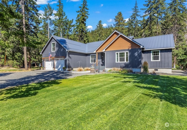 ranch-style home featuring a garage and a front yard