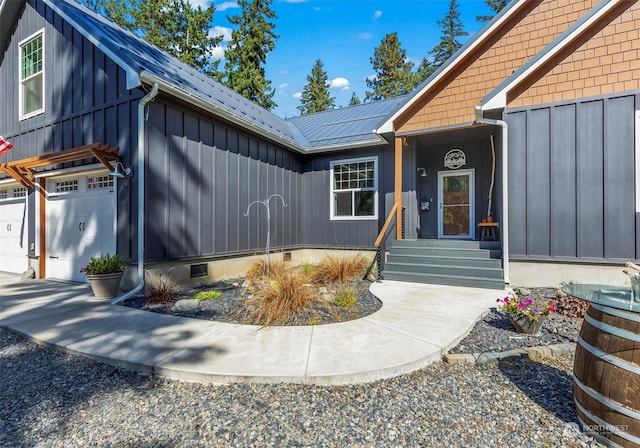 view of exterior entry with a garage