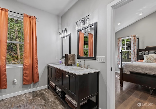 bathroom with plenty of natural light and vanity