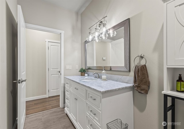 bathroom featuring hardwood / wood-style flooring and vanity