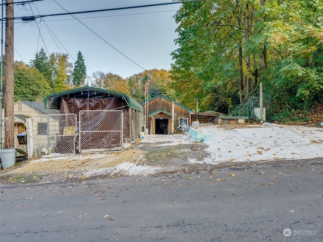 view of front of house with a storage shed