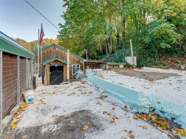 view of patio featuring a shed