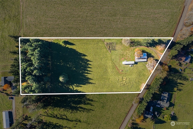 birds eye view of property featuring a rural view