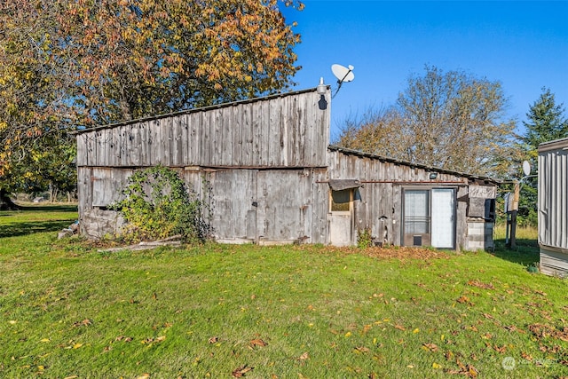 view of outdoor structure with a lawn