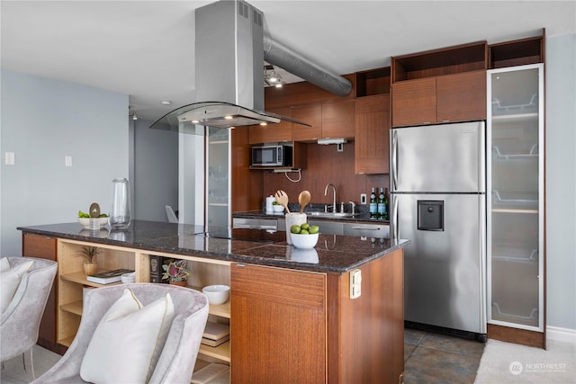 kitchen featuring sink, stainless steel appliances, tile patterned flooring, decorative backsplash, and island range hood