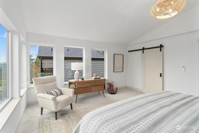 bedroom featuring multiple windows, a barn door, light colored carpet, and lofted ceiling