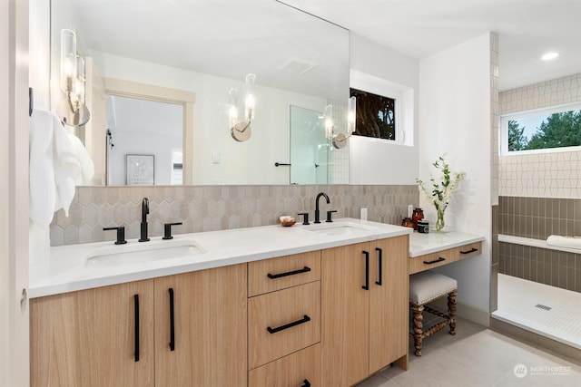 bathroom featuring vanity, decorative backsplash, walk in shower, and tile patterned flooring